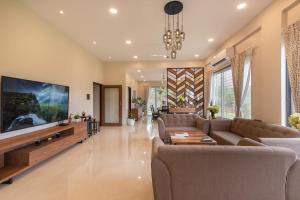 SaffronStays Midori - 4BR riverside villa with pool, lawn, terrace & access to Kundalika River rafting site