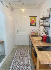 Appartements Gite Le Palmier - Perfectly located cosy studio with private garden : photos des chambres