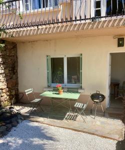 Appartements Gite Le Palmier - Perfectly located cosy studio with private garden : photos des chambres