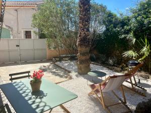 Appartements Gite Le Palmier - Perfectly located cosy studio with private garden : photos des chambres