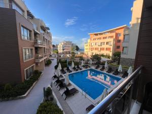 Modern 1BR Apartment with Sea View & Pool Included with Parking Space