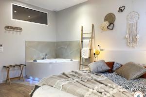 Appartements The Pearl  Balneo SPA  Ecran geant  Opt Parking : photos des chambres