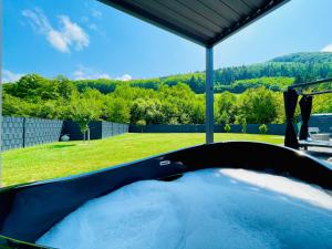 Voralpen Lodge - Ferienhaus mit Gym & Wellnessbereich