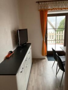 Three-Bedroom Apartment with Terrace room in Haus Obernig