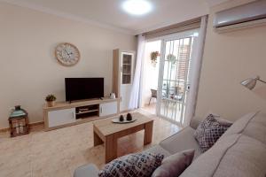 Apto ACHE, acogedor apartamento de 66 m con terraza, aire acondicionado y parking privado gratuito