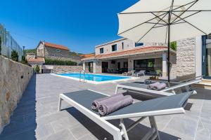 Stylish Villa Neven with 44sqm heated private pool, 4 en-suite bedrooms, 2 living and dining areas, wine cellar