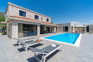 Stylish Villa Neven with 44sqm heated private pool, 4 en-suite bedrooms, 2 living and dining areas, wine cellar