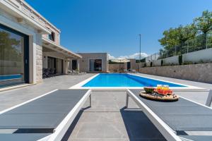 NEW Stylish Villa Neven with 44sqm heated private pool 4 ensuite bedrooms 2 living and dining areas wine cellar