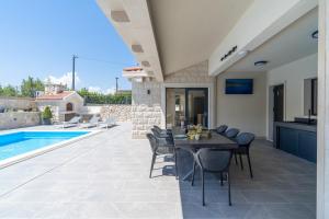 NEW Stylish Villa Neven with 44sqm heated private pool 4 ensuite bedrooms 2 living and dining areas wine cellar