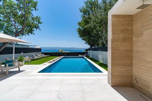 Beachfront Villa Erce with private 40sqm heated pool, a Gym, 7 en-suite bedrooms, a rooftop terrace, 2 living areas