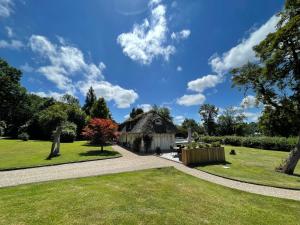 Maisons de vacances LES 2 CHAUMIERES Piscine & Spa : photos des chambres