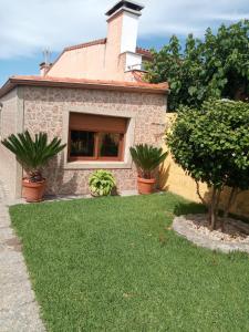 Casa con jardín en primera línea de playa