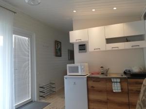 Poilsio namelis po juodalksniais (Nemirseta)