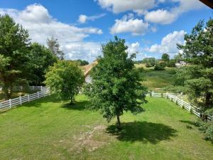 Greyówka dom kryty strzechą w Gardna Park