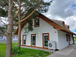 Greyówka dom kryty strzechą w Gardna Park