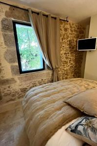 Appartements Le Donjon de Lily - Coeur de La Cite Medievale : photos des chambres