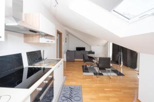 Sunny attic apartment with balcony & Modern city apartment with outdoor area, no balcony