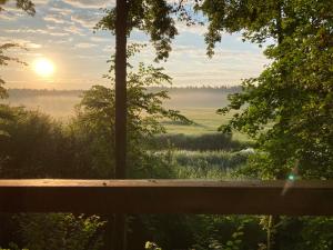 Pustelnia Supraśl - domki nad rzeką