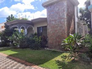 Cardamon Villa is a 2 bedroom with 1 bathroom and seperate toilet detached house with AC and swimming pool , 5 minutes walk from Flic en Flac public beach