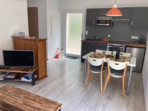 Appartements Gites au jardin : photos des chambres