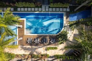 Boulevard 123 D - Apartamento com 3 dormitórios em elegante condomínio com piscina aquecida na praia do centro de Bombinhas