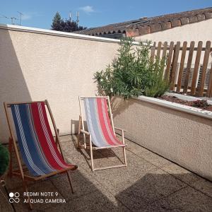 Appartements UNE TERRASSE EN VILLE : photos des chambres