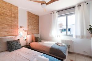 Maisons de vacances Guilhermy - Maison contemporaine avec jardin : photos des chambres