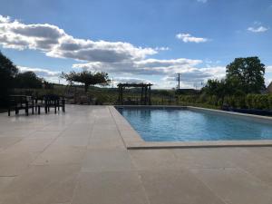 Maisons de vacances La Petite maison de Celine & Frederic avec piscine a Prehy : photos des chambres