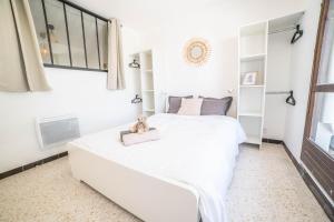 Appartements LE WHITE - CLIM PARKING WIFI 5min PLAGE NEUF 6MAX -CoHoteConciergerie : photos des chambres