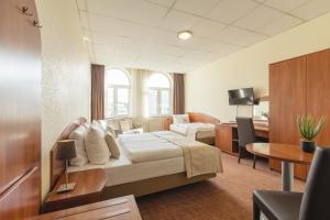 Comfort Quadruple Room room in Novum Hotel Hamburg Stadtzentrum