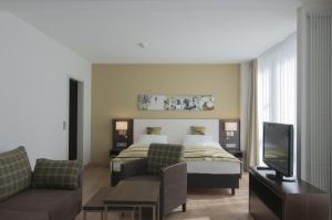 King Suite with Sofa Bed room in Holiday Inn Munich Unterhaching an IHG Hotel