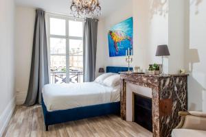 Appartements Suites Mana - Suite Bleu Pacifique - Place Ducale avec Parking prive inclus : photos des chambres