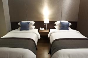 Phòng Hai Giường Đơn Loại Sang (Deluxe Twin Room)