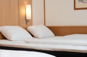 Standard Room with One Double Bed and One Single Bed room in ibis Hotel Eisenach