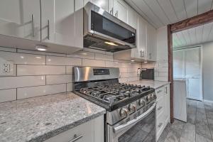 Prudenville Retreat with Yard about 1 Mi to Lake!