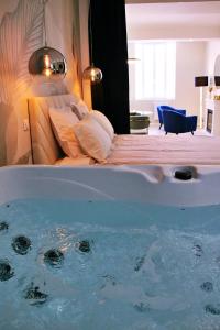 Appartements Appartement luxueux avec Jacuzzi privatif : photos des chambres