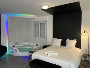 Appartements NG SuiteHome - Queven - Balneo - Netflix - Wifi : photos des chambres