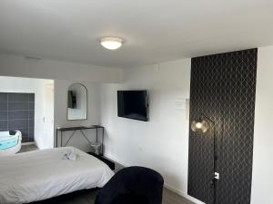 Appartements NG SuiteHome Queven Balneo I Retroprojecteur : photos des chambres
