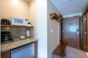 Unequalled Ski in Out Location Next to Gondola, Hotel Room, Pool, Hot tubs, Condo Nast Winner C005A