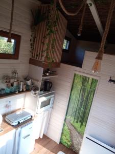 Maisons de vacances La tiny house exigue IJ : photos des chambres