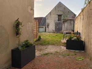 Appartements L'Ilot du Perche: Appartement cosy avec jardin : photos des chambres