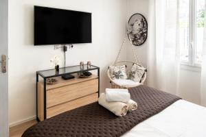 Maisons de vacances L'Oursinade - Jolie maison avec Jacuzzi et jardin : photos des chambres