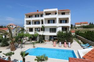 Family friendly apartments with a swimming pool Novalja, Pag - 14396 