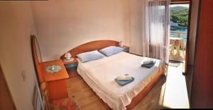 Two-Bedroom Apartment with Balcony and Sea View room in Apartment Povlja 14399c