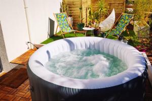 Superbe appartement avec jacuzzi avec jardin privé