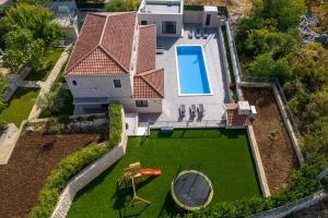 Stylish Villa Neven with 44sqm heated private pool, 4 en-suite bedrooms, 2 living and dining areas, wine cellar
