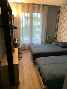 Appartements Au coeur de Lisieux 83 m2 et vue sur la Basilique : photos des chambres