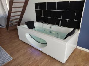 Appartements NG SUITEHOME BLANC SEAU BALNEO : photos des chambres