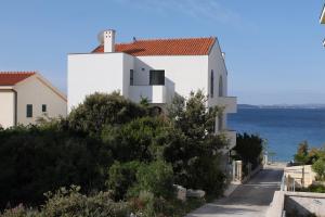 Family friendly seaside apartments Kozino, Zadar - 6184 - 3hvězdičkové hotely ve městě Petrcane