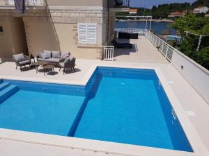 Seaside apartments with a swimming pool Lumbarda, Korcula - 9303